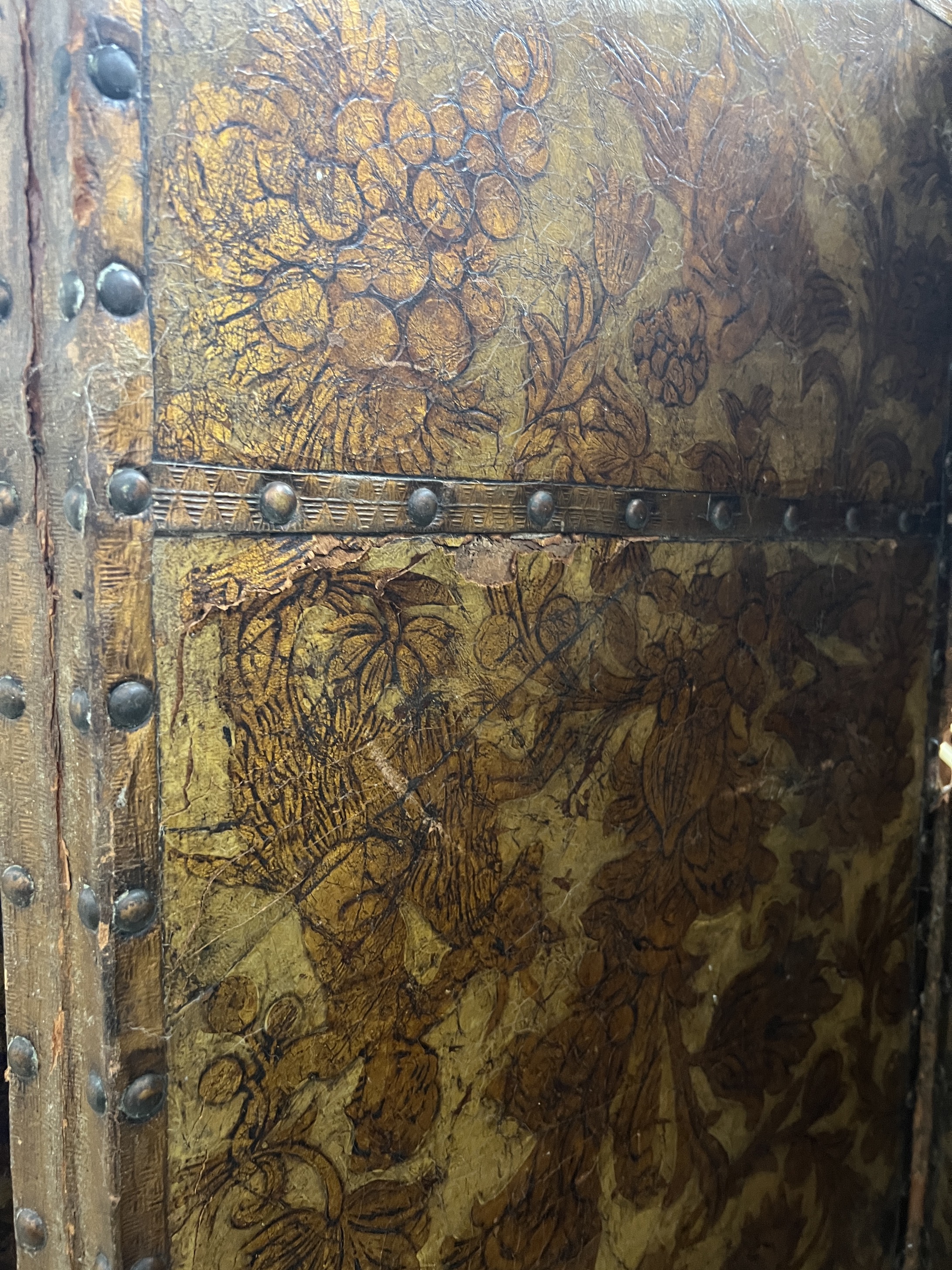 An 18th century Dutch leather four fold painted dressing screen, each panel width 61cm, height 198cm